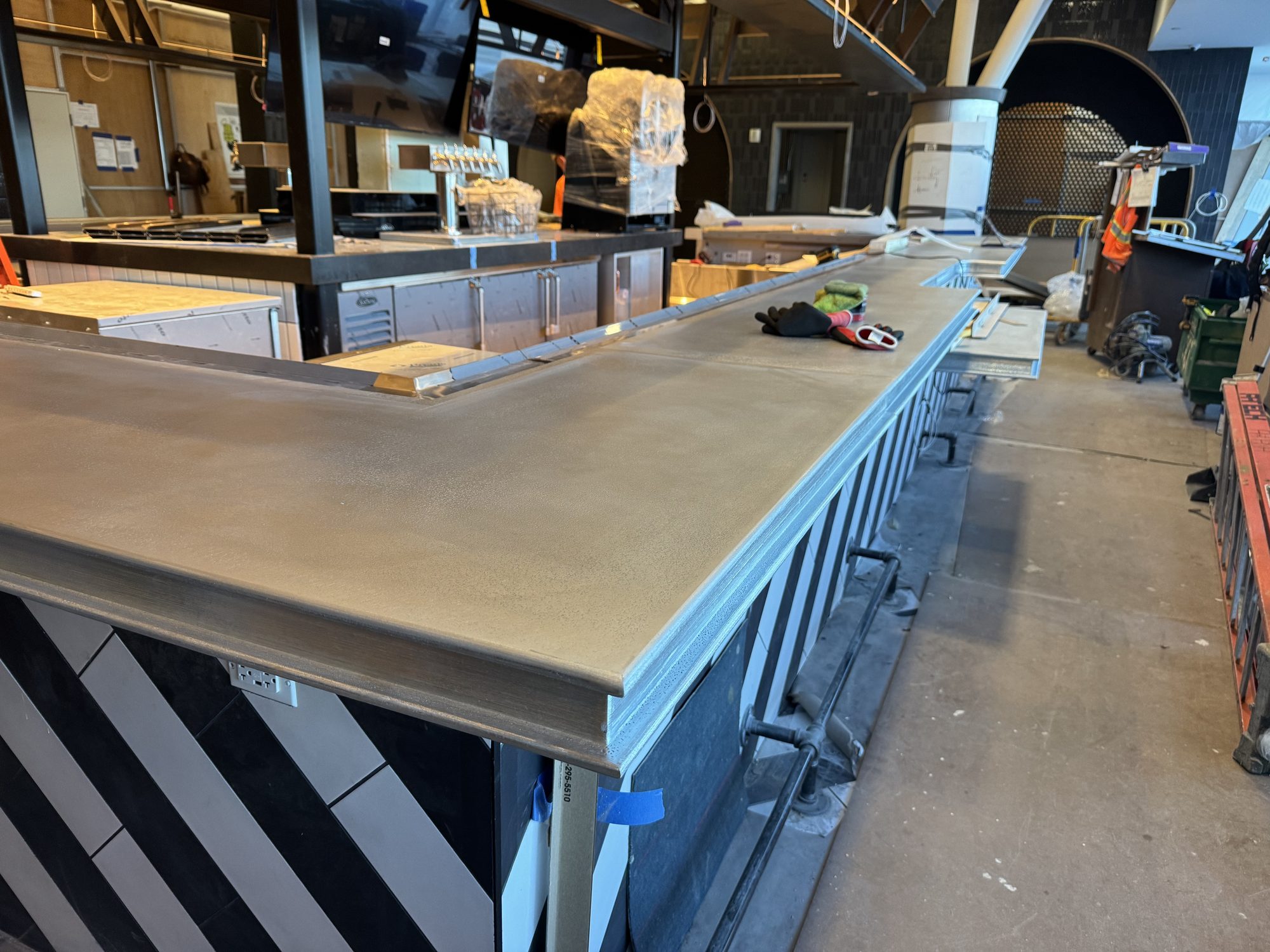Long zinc bar run installed ahead of opening at Black Tap, JFK Terminal 8, New York