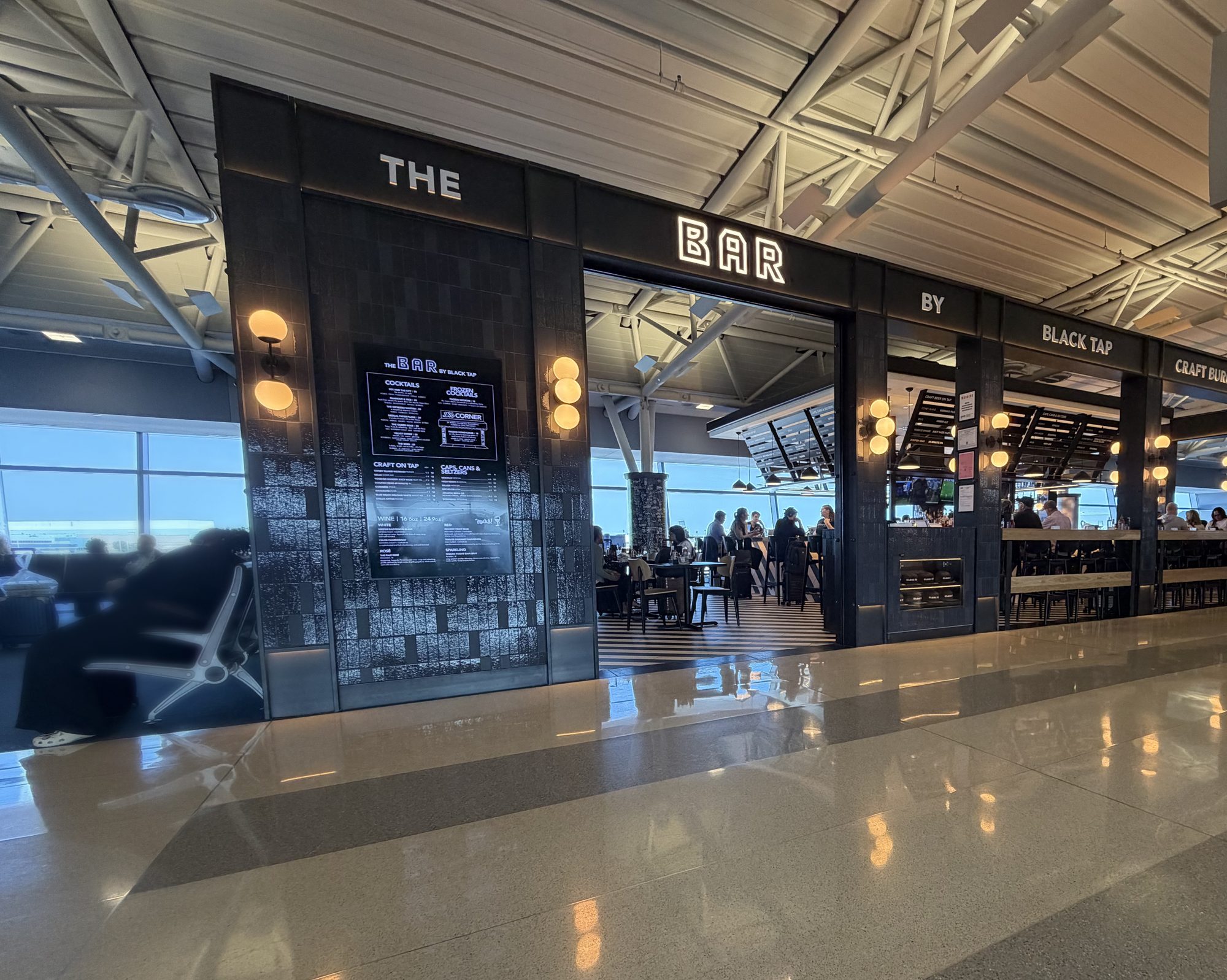 Storefront of The Bar by Black Tap on the concourse at JFK Terminal 8, New York