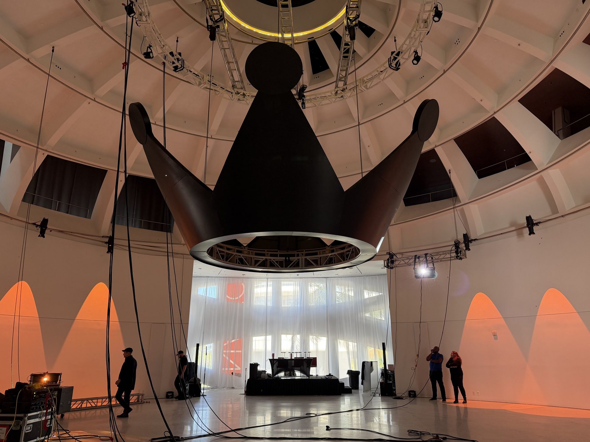 Giant matte-black crown suspended beneath the dome at Faena Miami Beach