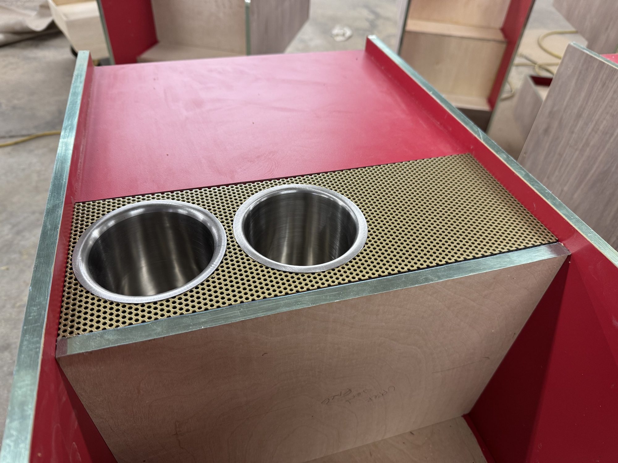 Twin ice wells set in a perforated brass panel on a Rémy Martin bar cart