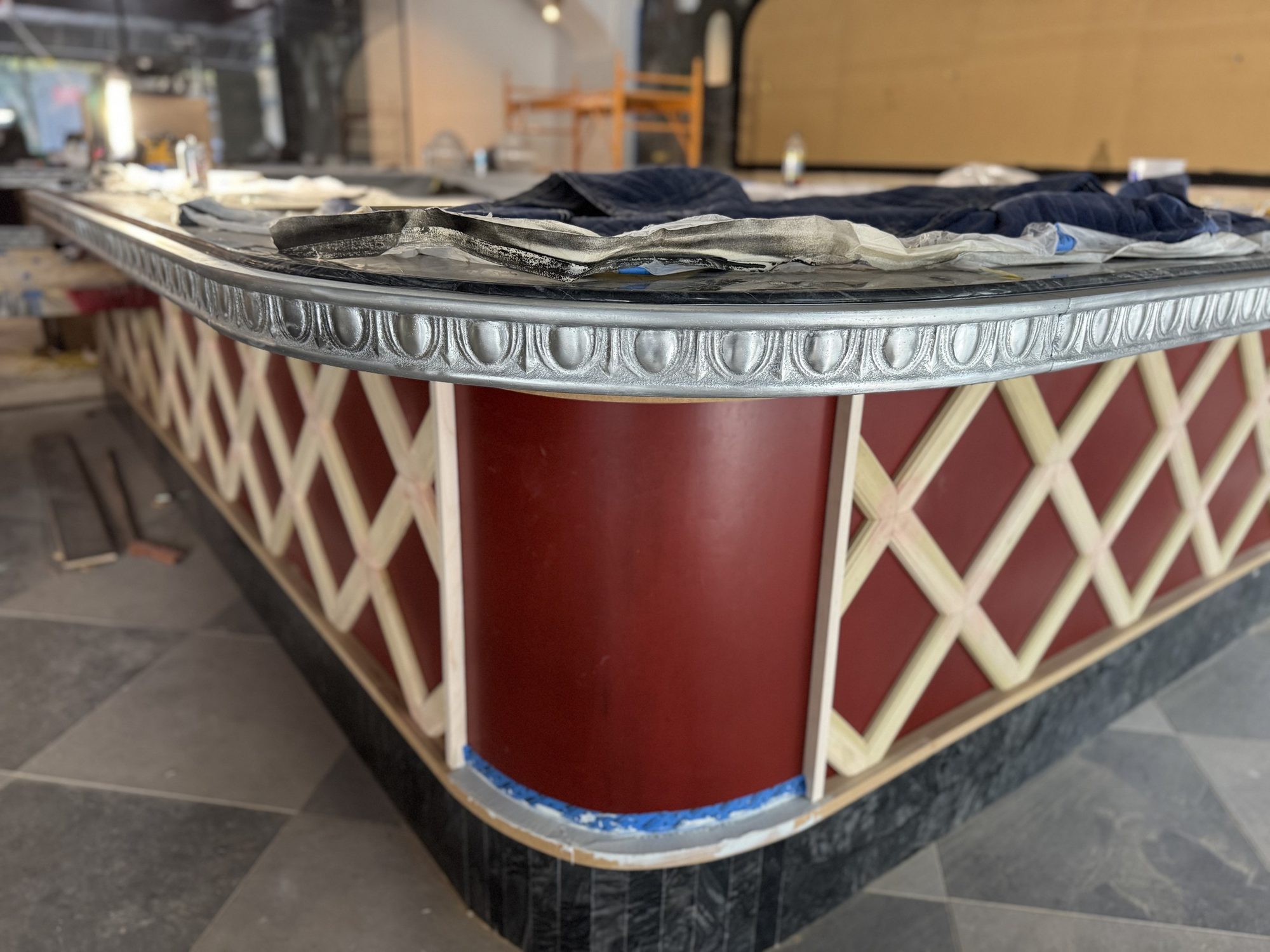 Bar with zinc egg-and-dart edge trim during fit-out at Restaurant François, Austin