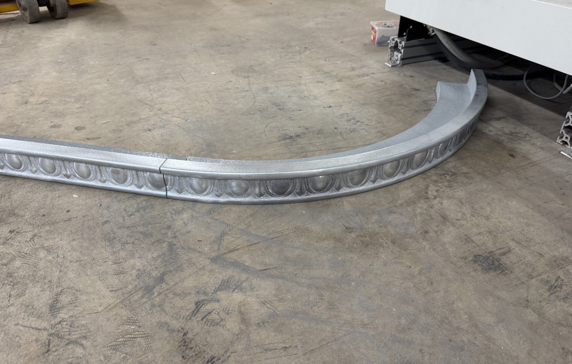 Curved run of zinc bar trim before install at Restaurant François, Austin