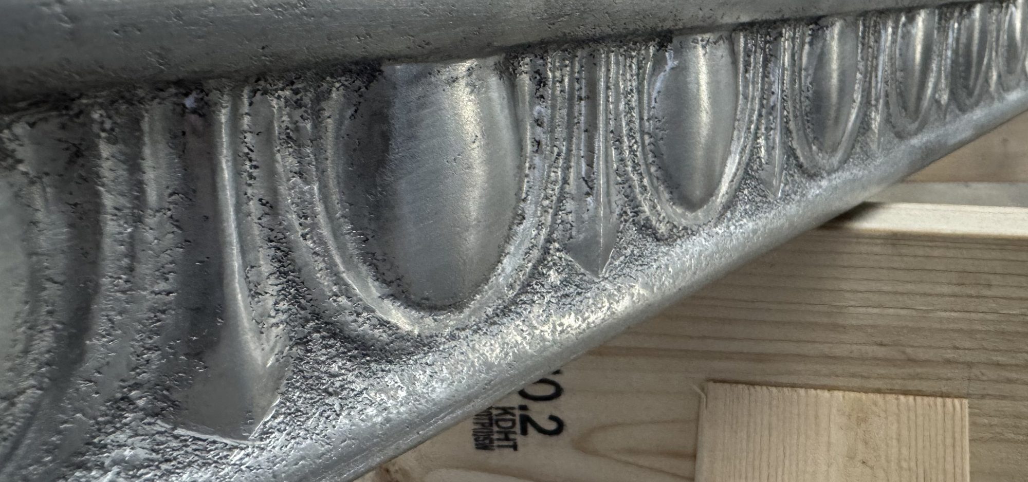 Zinc egg-and-dart bar trim, unpatinated, before installation at Restaurant François, Austin