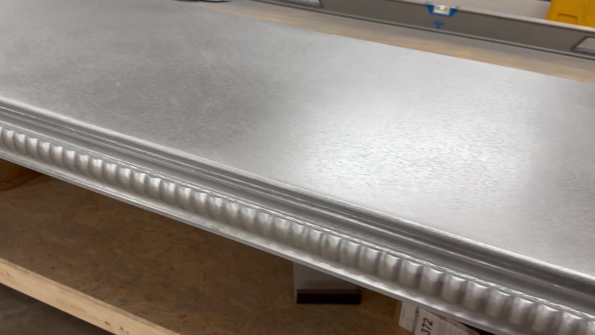 Pillowed edge profile running along a finished zinc bar top section before delivery to Uptown Social, Charleston