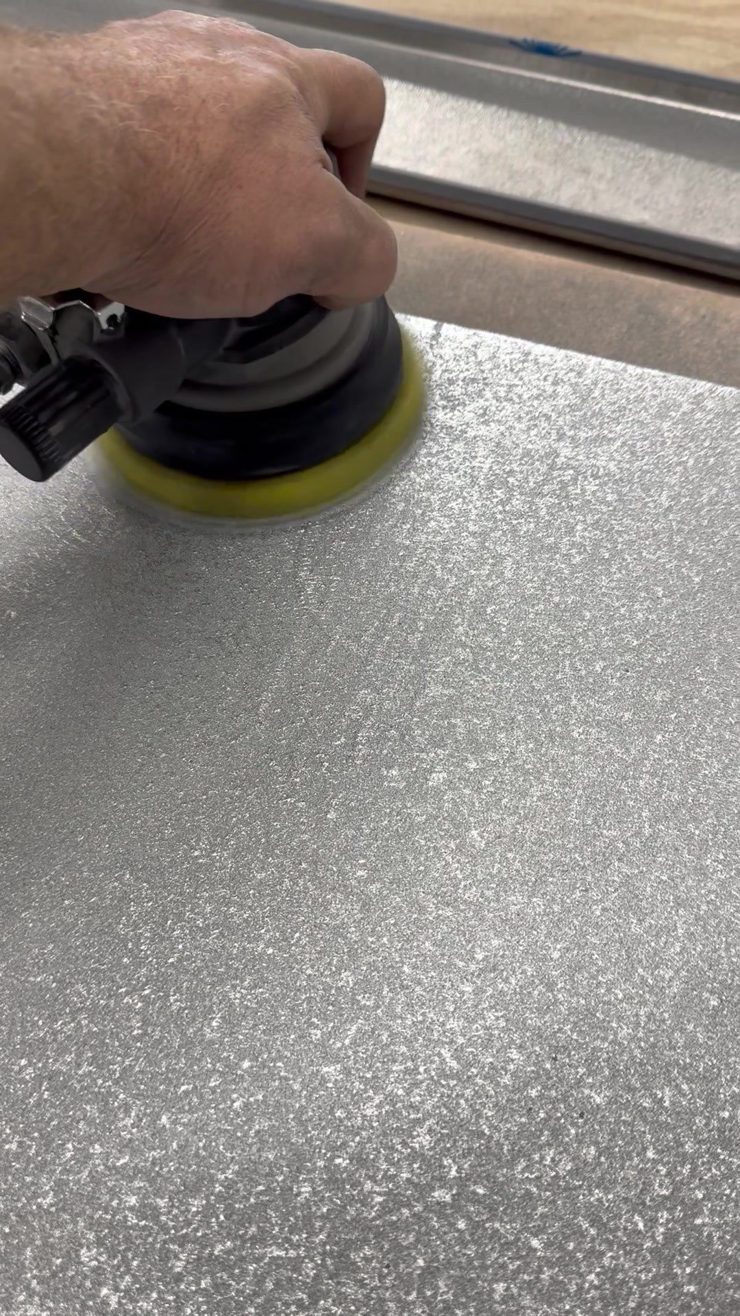 Zinc bar top surface being finished by hand for Uptown Social, Charleston